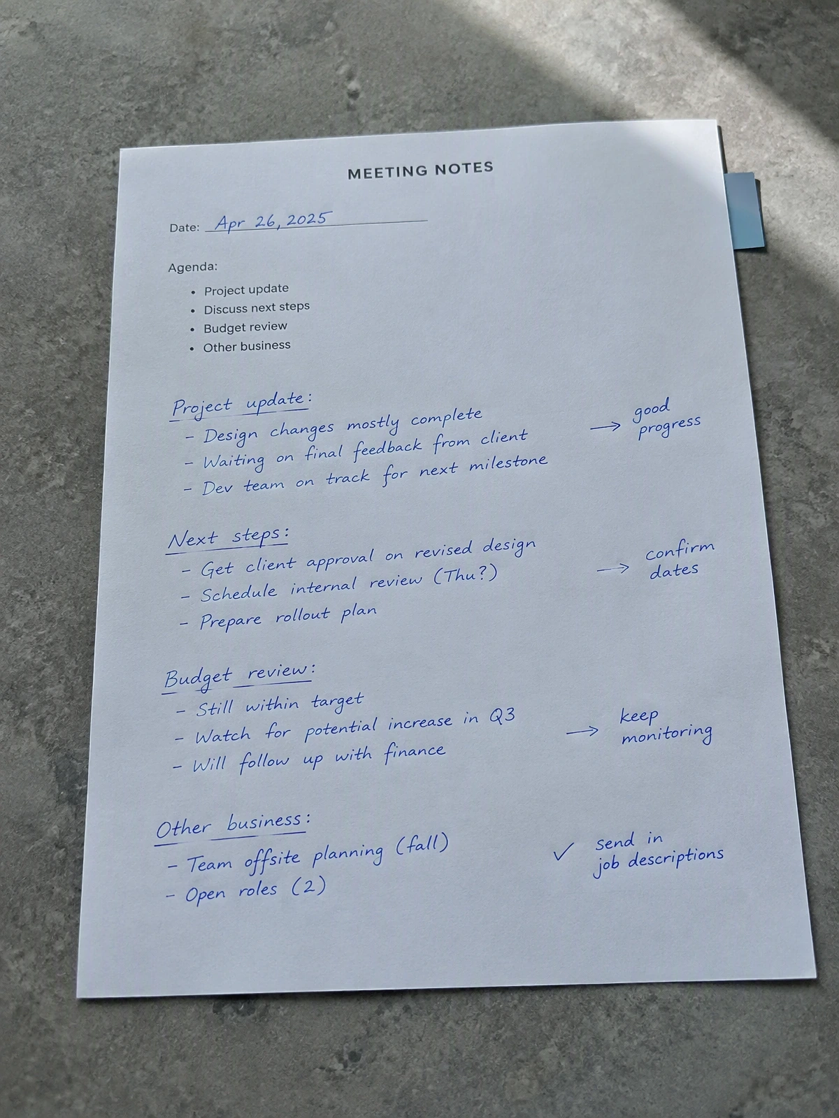 Illustrative worksheet photo with blue handwritten notes